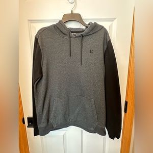 Men’s gray and black Hurley pullover hoodie, size Medium.